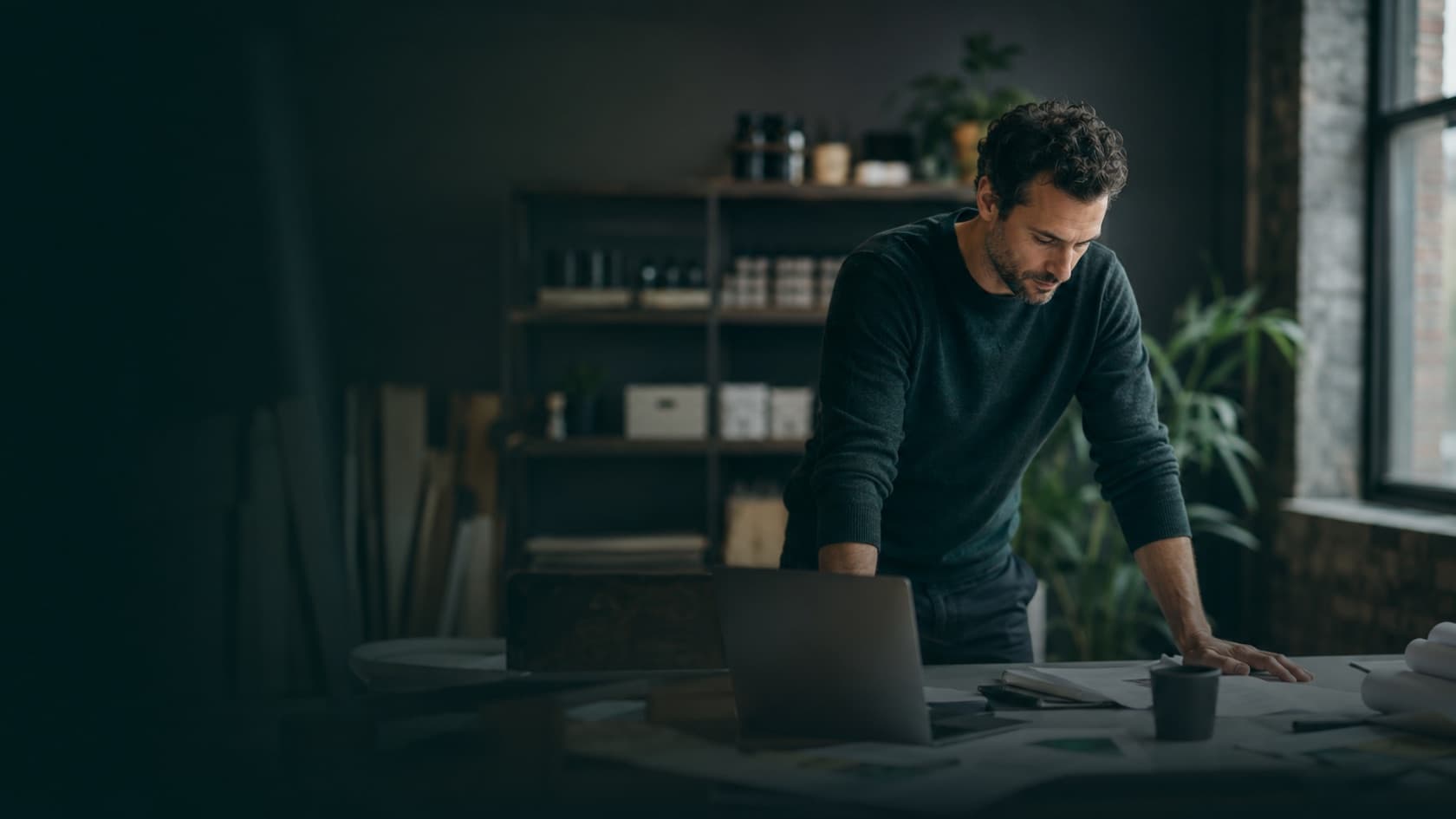A business owner reviewing website performance at their desk
